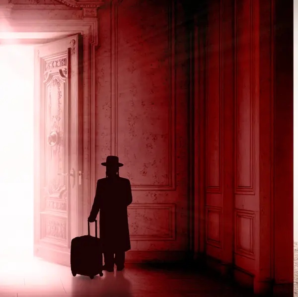 A guest arriving at an open, lit doorway at night