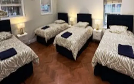 A bedroom in one of the Vaad's apartments, made up for guests